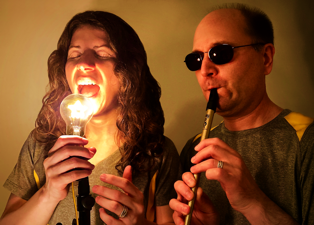 Bridget Sings into a Star-Shaped Light Bulb as though it's a Microphone while Matthew Plays a Gold Tin Whistle